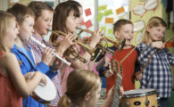 Group Of Students Playing In School Orchestra Together